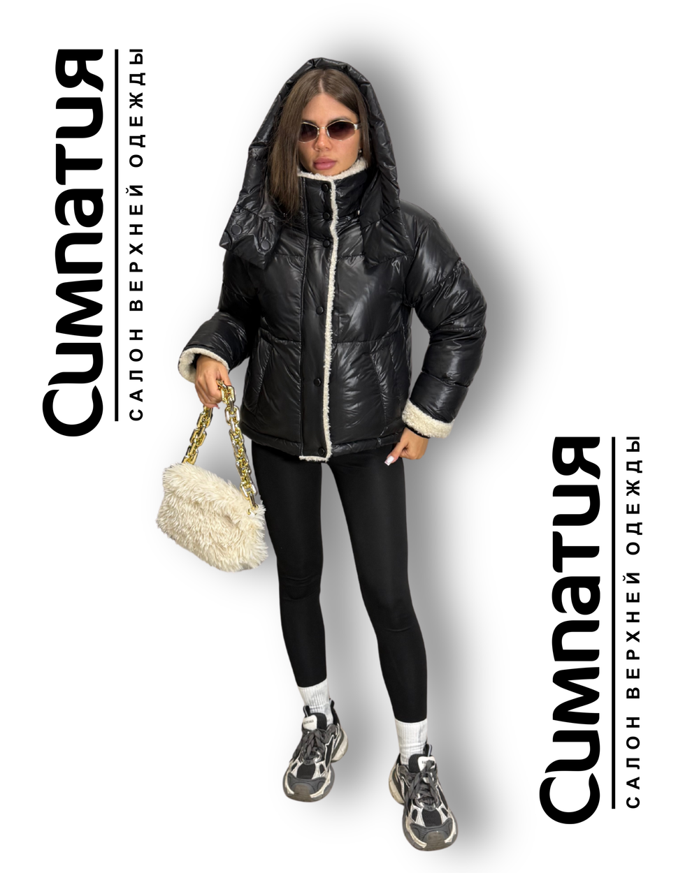 Зимняя куртка в черном цвете с декоративными деталями из эко меха