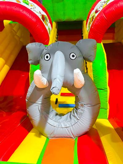Надувной батут "Слоник в джунглях с двумя горками с переходом" 6*5*5.5 м