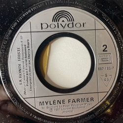 Винтажная виниловая пластинка 7 дюймов (маленькая пластинка) Mylene Farmer Sans Contrefacon (Франция 1987)