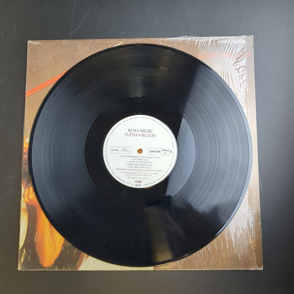 LP Roxy Music - Flesh + Blood Зарубежный рок. Виниловая пластинка 12 дюймов.Германия.1980 год. Конверт VG+ / Диск VG+