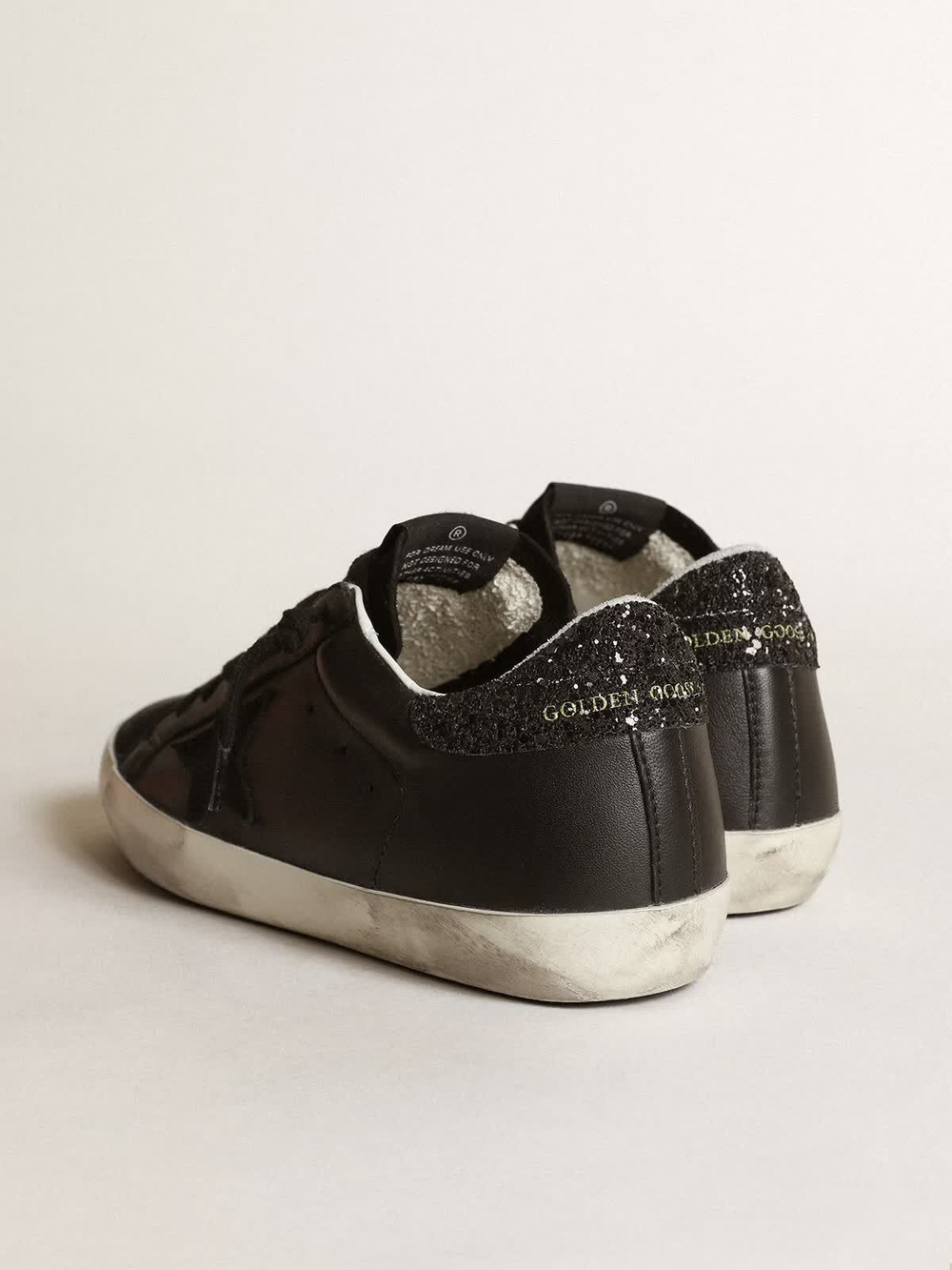 Super Star in black nappa with black star and glitter heel tab