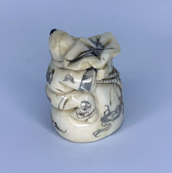 Нэцкэ Ребенок карако на огромном мешке риса