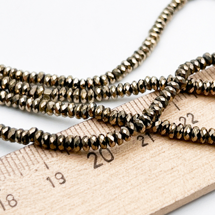 Гематит Рондель граненый бусины (имитация), цвет золотисто-бронзовый, размер около 1,5*3,2 мм, цена за отрезок 18 см (1/2 нити)