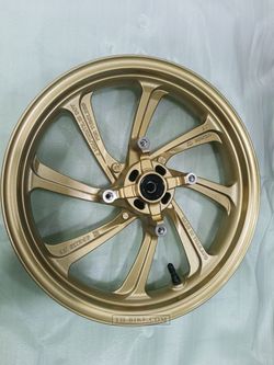 44650-K97-T00ZB. WHEEL SUB ASSY., FR. Gold color. Honda PCX