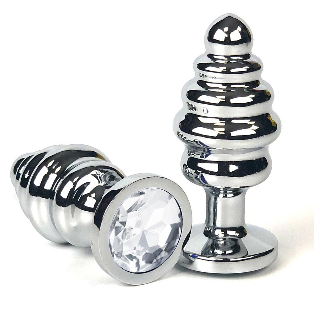 Серебристая ребристая анальная пробка с прозрачным кристаллом - 7 см. (Цвет: прозрачный)