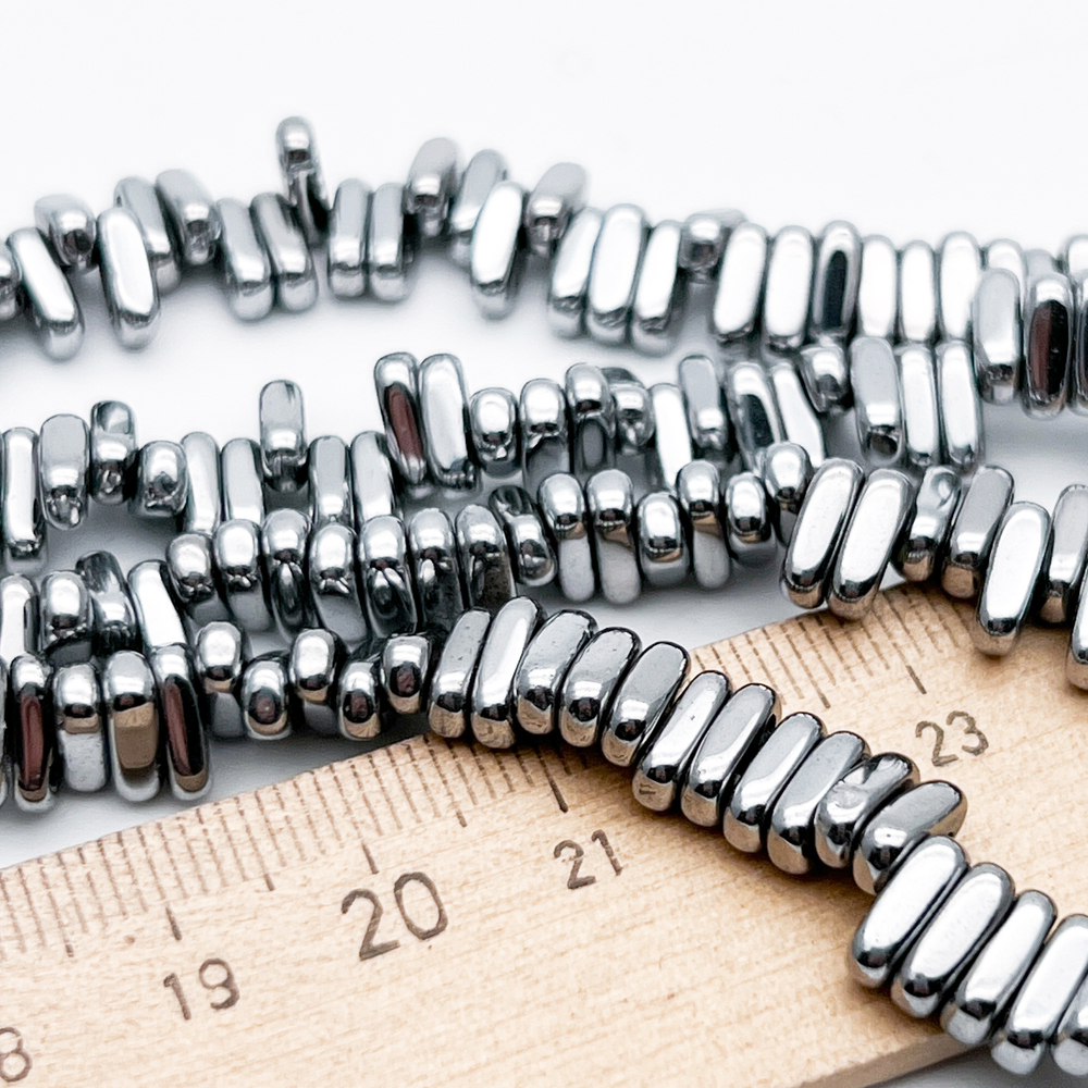 Гематит 2 отверстия бусины (имитация), цвет серебристый, размер около 8*2,5 мм, цена за отрезок 19 см (1/2 нити)