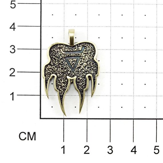 Бронзовая печать Велеса волчья на размерной сетке с тыльной стороны.