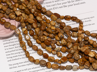 Нить бусин из песочной яшмы 7х9мм, галтовка