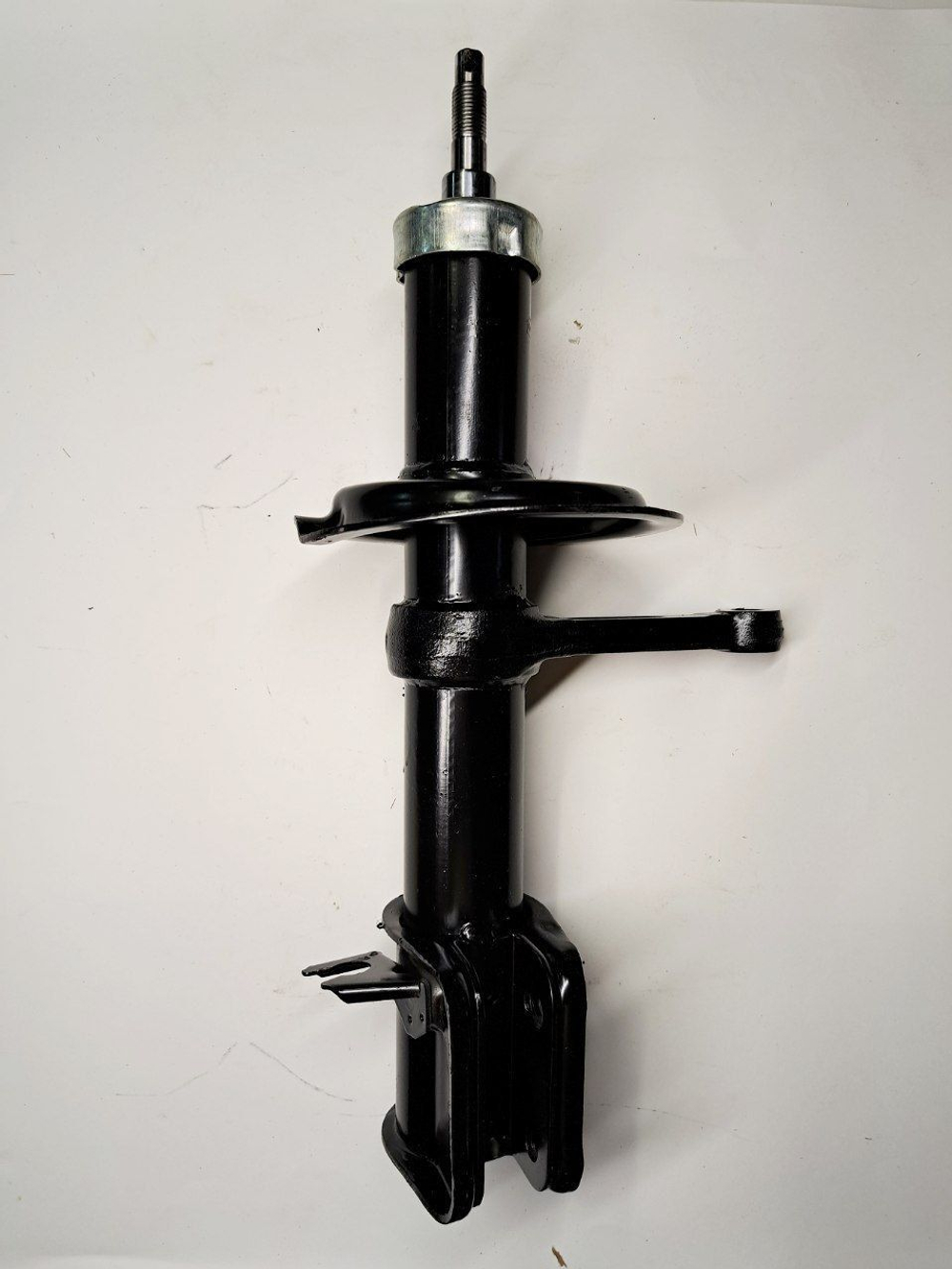 Стойка амортизатора передняя правая 1119-2905402 Птимаш