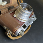 №13 Фотоаппарат "ФЭД-2" с объективом "Индустар - 62м" в оригинальном кофре с документом , металл, стекло, кожа, Харьковский машиностроительный завод им. Дзержинского (ФЭД), СССР, 1961-1979 гг.