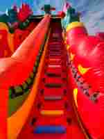 Коммерческий надувной батут «Змей Горыныч» с механизированной головой 14*8*7 м