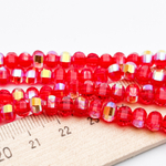 Бусины стекло, цвет красный АВ, размер 4,5*6 мм, цена за отрезок 19 см (1/2 нити)