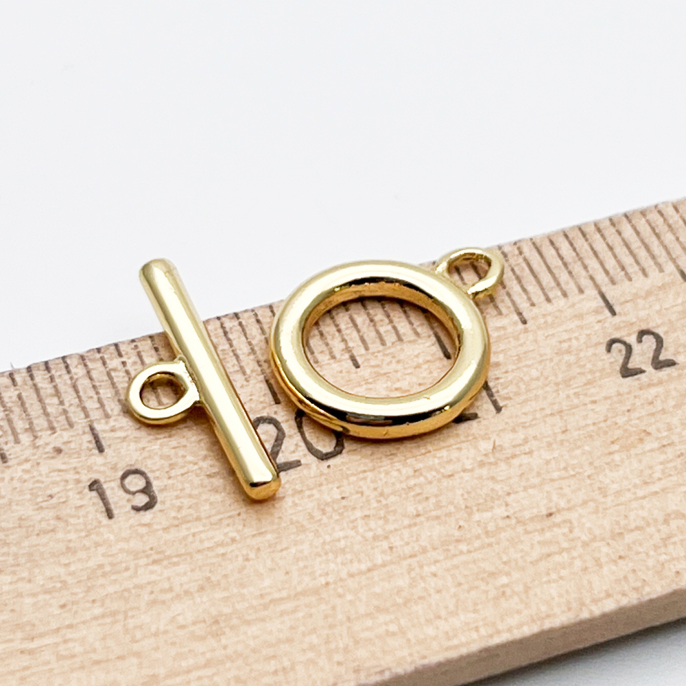 Замок-тоггл, цвет золото, размер 16*12 мм, цена за 1 шт