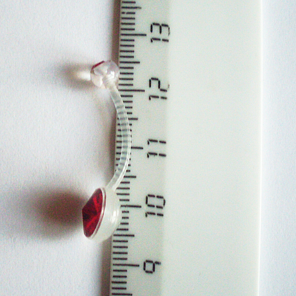 Для пирсинга пупка ( длина 20 мм) с Красными кристаллами. Материал биофлекс ( для беременных)