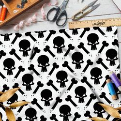 Ткань шифон чёрные черепа и кости на бежевом фоне