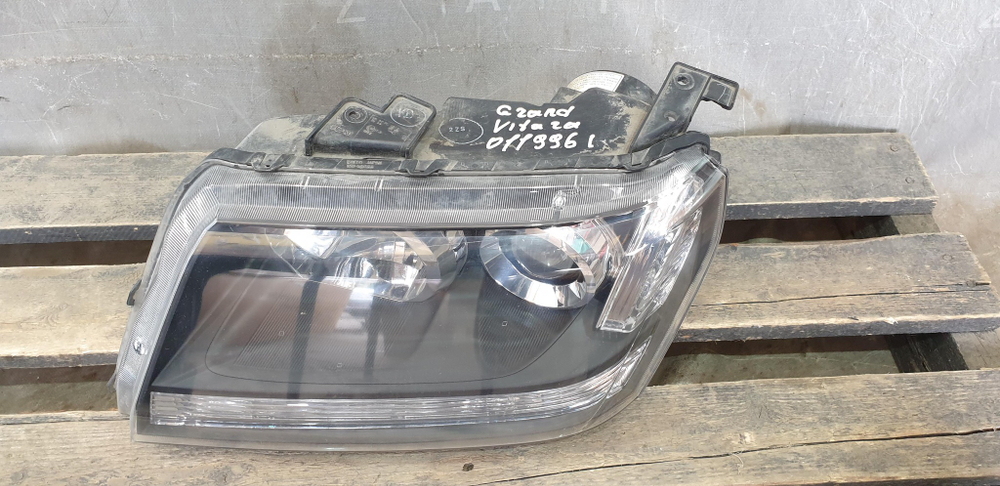 Фара левая ксенон Suzuki Grand Vitara 2 (JT) 05-15 Б/У Оригинал 10059088
