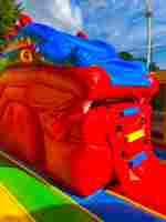 Коммерческий надувной батут «Драконы в тропиках» с механизированной головой, 14*7*7,3 м