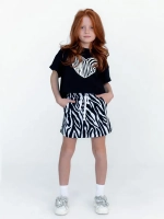 Черно-белый костюм для девочки с юбкой на весну