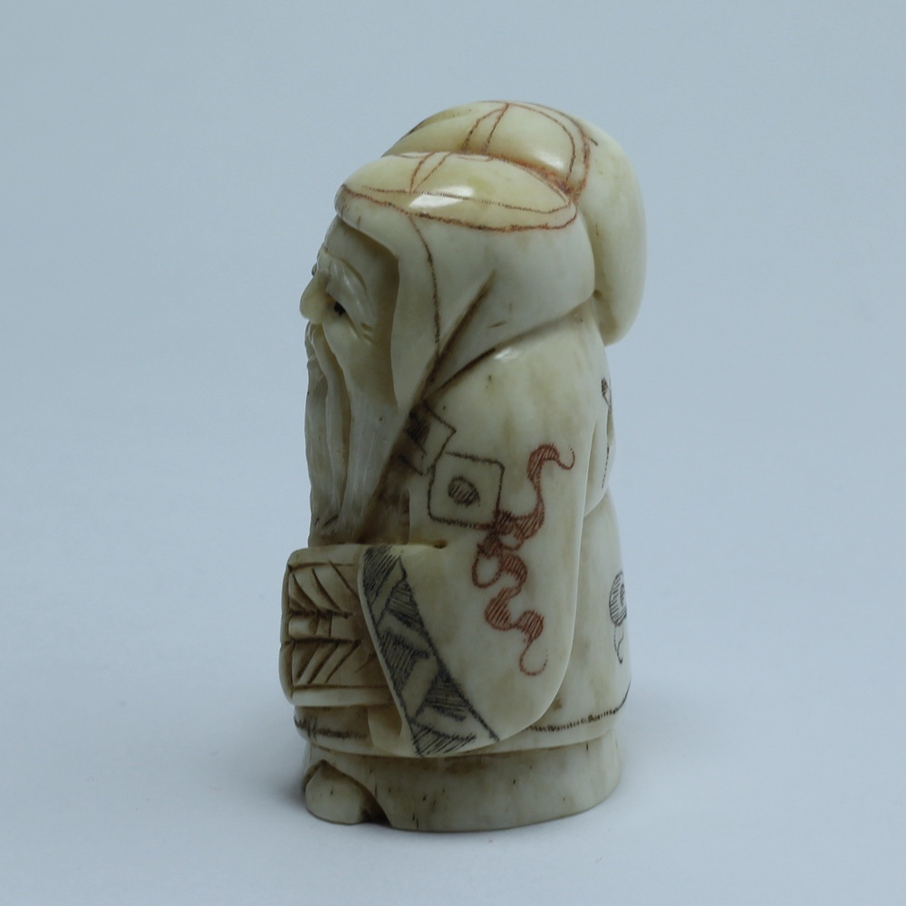 Нэцкэ Фукурокудзю с мешком риса и веером