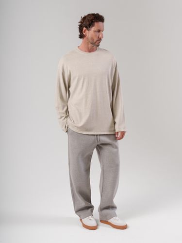 Бежевый лонгслив с необработанным краем