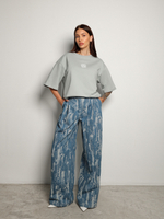 Джинсы с гранжевым эффектом голубые