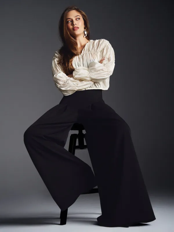 Брюки с защипами 