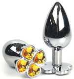 Серебристая анальная втулка с клевером из оранжевых кристаллов - 6 см. (Цвет: оранжевый)