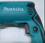 Ударная дрель Maкита HP 1630
