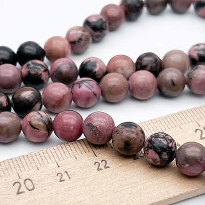 Родонит бусины, диаметр 8-8,2 мм, цена за 23-24 шт (1/2 нити)