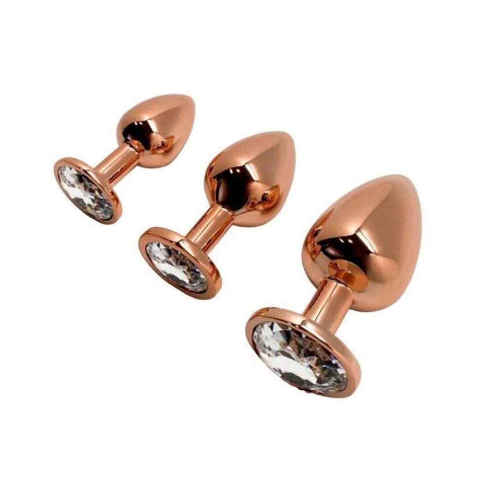 Анальная пробка золотистого цвета с белым кристаллом Tralalo от WOOOMY  (M: 8*3,4 см.)