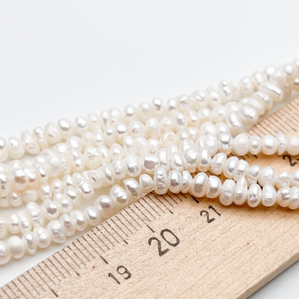 Жемчуг, размер около 2,5*4 мм, цена за нить 35 см