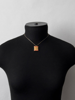 Кулон с лого и оранжевой эмалью Givenchy 1981 год