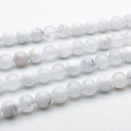 Опал белый бусины, диаметр 6,4-6,6 мм, цена за 14-15 шт (1/4 нити)