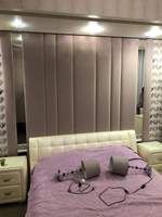 Двуспальная кровать с мягким изголовьем и стильным дизайном