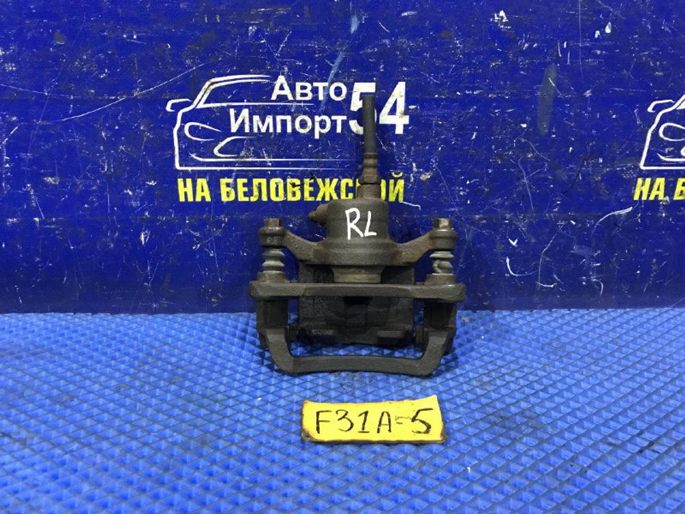 Суппорт тормозной задний левый MITSUBISHI DIAMANTE 2000