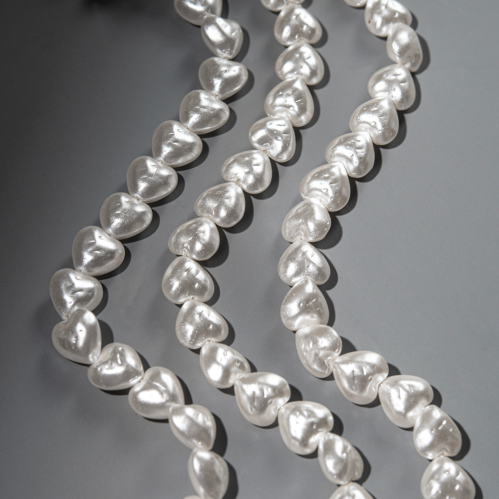 Хрустальный жемчуг в форме сердечек с бороздками, белый 12мм