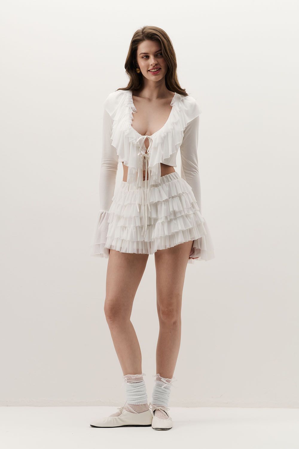 Блуза с оборками кремового цвета