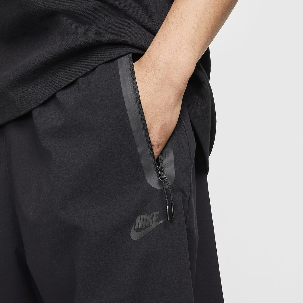 HM7158-010 Брюки M NK TCH WVN PANT OS