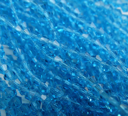 ББ016НН3 Хрустальные бусины "биконус", цвет:ярко-голубой прозрачный, размер 3 мм, кол-во: 95-100 шт.