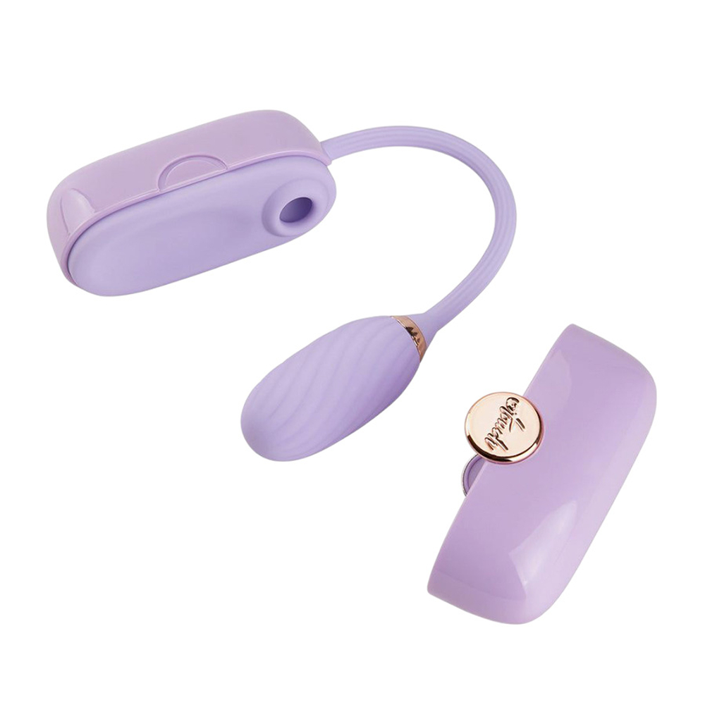Фиолетовое силиконовое виброяйцо с вакуумным стимулятором в роскошной сумочки Otouch Louis Vibrator Dual Clitoral Suction & G-spot Vibrating Egg Purple
