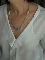 Колье с палочками, биколор, золото и серебро. Сталь.