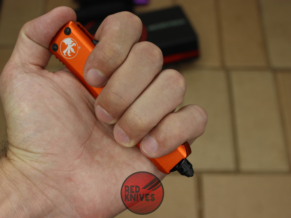 Нож Microtech UTX-85 T/E - оранжевая рукоять, танто клинок, черный RK-396