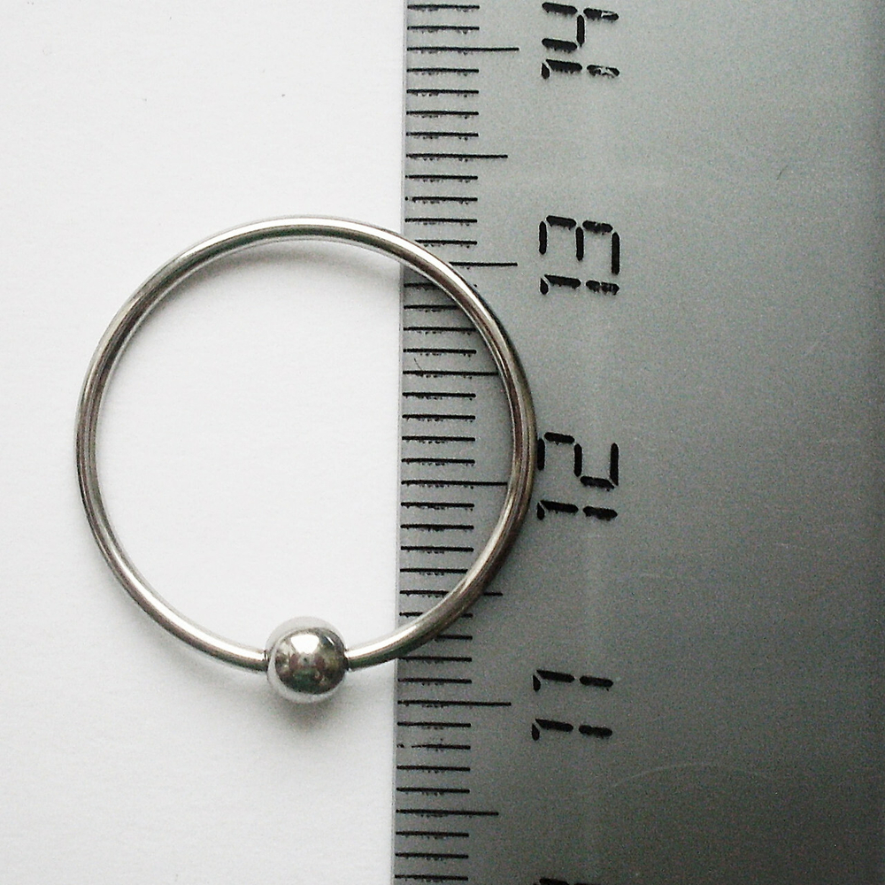 Кольцо сегментное для пирсинга: диаметр 20 мм, толщина 1,2 мм, шарик 4 мм. Медицинская сталь. 1 шт