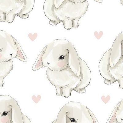 Милые кролики с сердечками на белом фоне