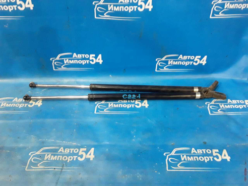 Амортизатор задней двери левый NISSAN VANETTE 1991