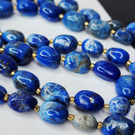 Лазурит с включениями пирита, крупная галтовка, 12-15 мм, камни овалы, цена за нить 12.5 - 13 см (1/3 нити)
