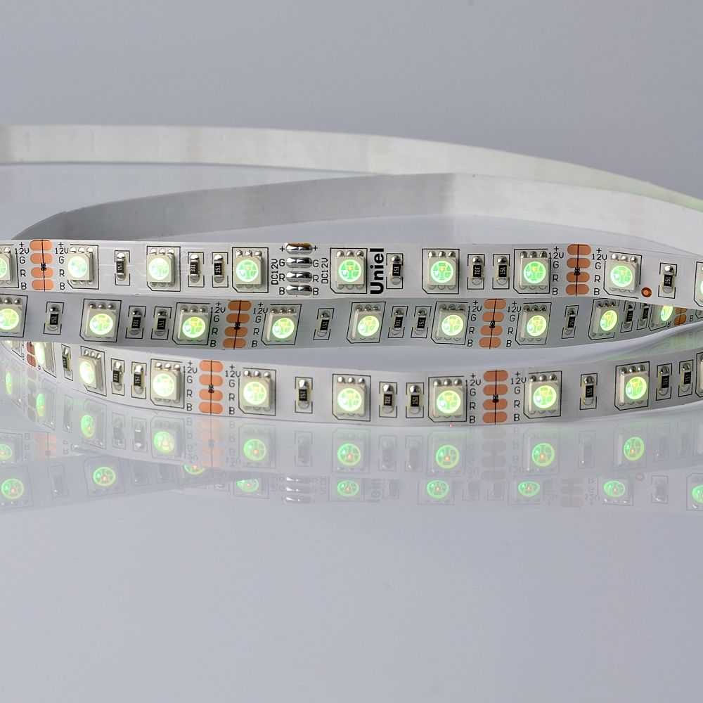 ULS-5050-60LED-m-10mm-IP20-DC24V-14.4W-m-5M-RGB Гибкая светодиодная лента UNIEL на самоклеящейся основе. Упаковка катушка 5 м. в герметичной упаковке. IP20. Угол излучения 120 . Мультиколор.