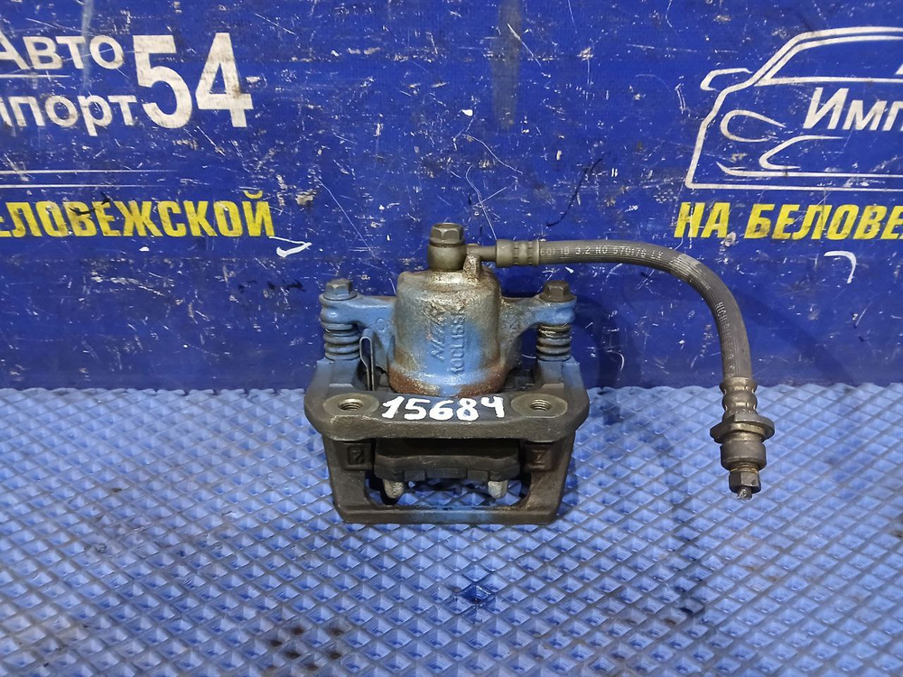 Суппорт тормозной задний левый Honda STEPWGN 1996-2001