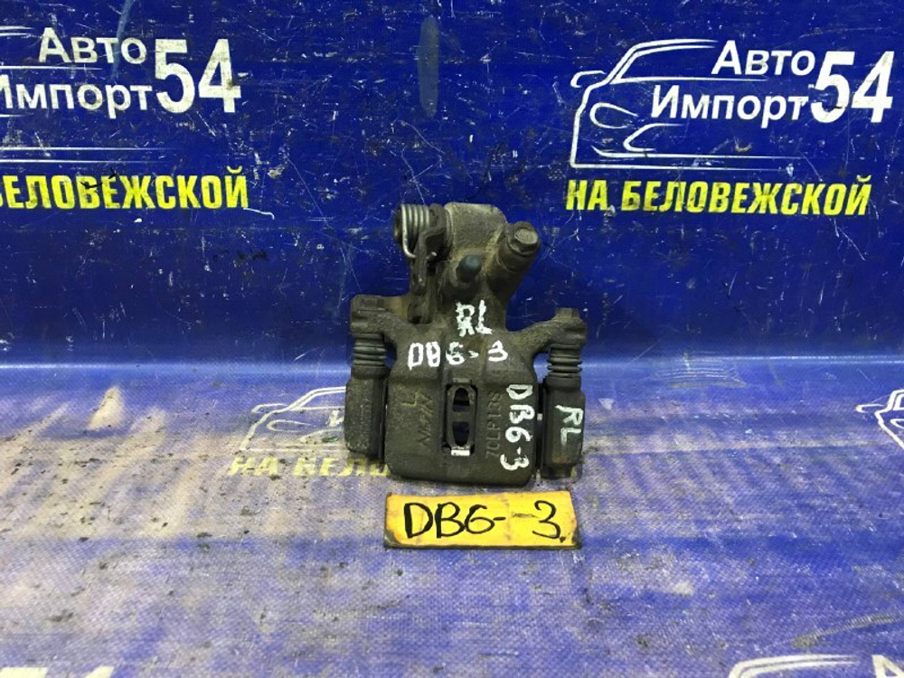 Суппорт тормозной задний левый Honda INTEGRA 2000