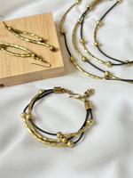 Браслет многослойный палочки с шариками на черной коже, бронза